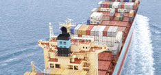 Cargo ship with freight containers at sea