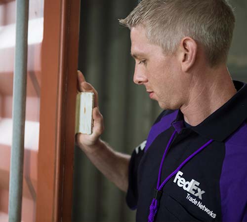 FedEx Trade Networks distribution employee in warehouse
